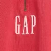 Tung, oversized genser med logo og kvart glidelås