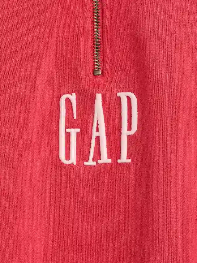 Tung, oversized genser med logo og kvart glidelås