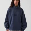 Tung, oversized genser med logo og kvart glidelås