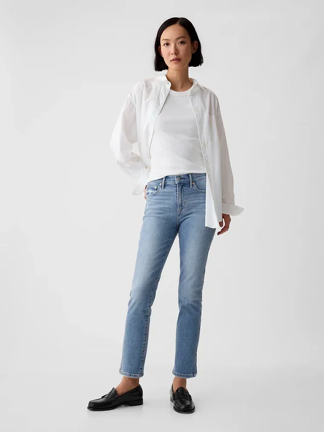 Vintage-jeans med middels høy midje, smal passform og splittet kant