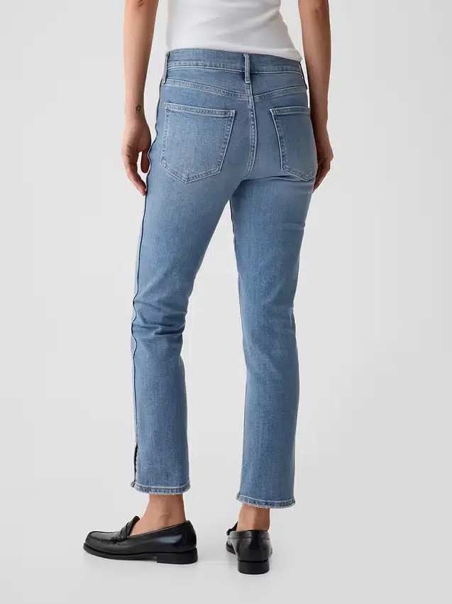 Vintage-jeans med middels høy midje, smal passform og splittet kant