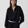 Vintagesoft oversized genser med halv glidelås og kileformet hals