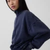 Vintagesoft oversized genser med halv glidelås og kileformet hals